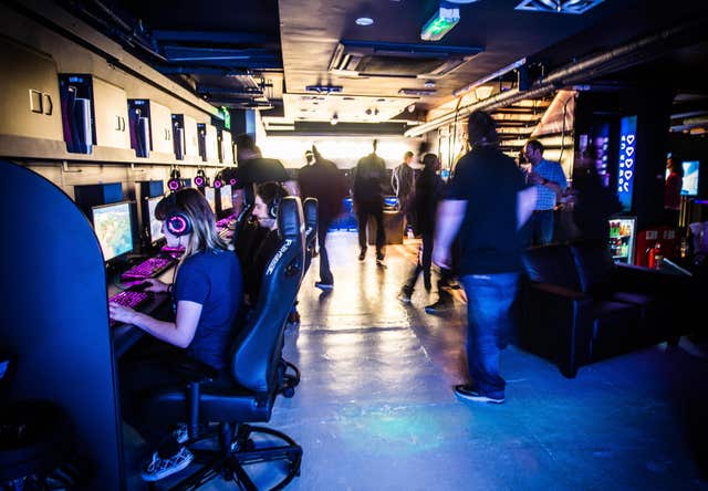 2-29481315 Gamers are pictured playing