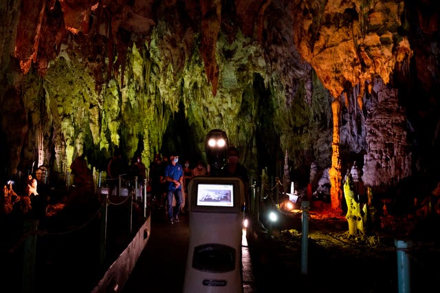 2-61804451 Persephone guides the visitors inside Alistrati cave, north-east of Thessaloniki, Greece