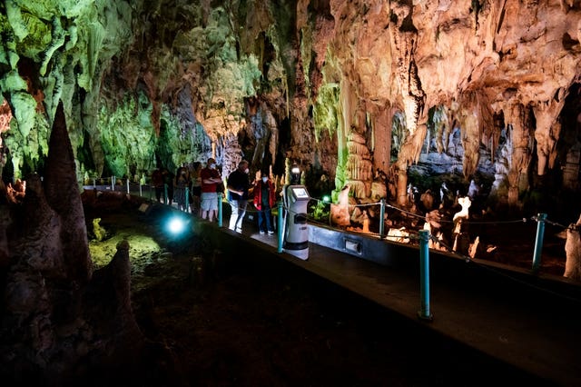 2-61804509 Persephone guides visitors inside the Alistrati cave, north-east of Thessaloniki, Greece
