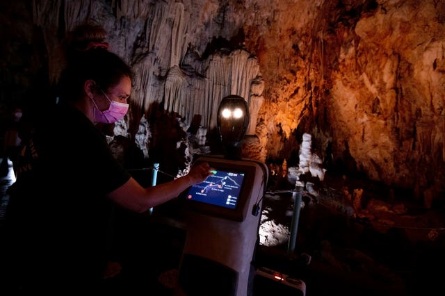 2-61804513 A guide programs Persephone inside Alistrati cave, north-east of Thessaloniki, Greece