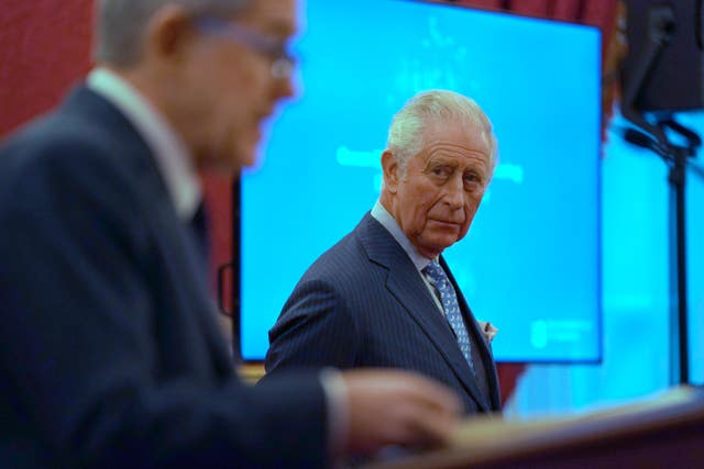 2-64205747 The Prince of Wales listens as Lord Browne speaks