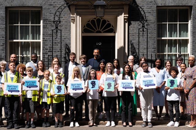 2-67529672 Rio Ferdinand poses for photographs with children at 10 Downing Street to celebrate the launch of the Diana Award’s annual anti-bullying campaign Don’t Face It Alone (Stefan Rousseau/PA)