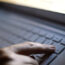A hand at a keyboard