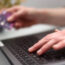 Person uses laptop