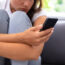 A woman looking at a smarphone