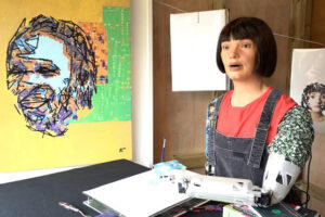Robot painting Glastonbury’s famous faces says festival atmosphere is ‘electric’