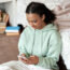 A teenager using a mobile phone