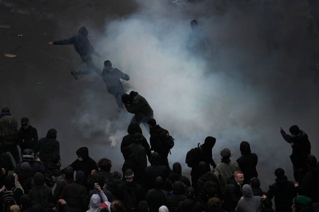 45b452cc9103443489a849167fea875d Protesters scuffle at the end of a rally in Paris on Thursday