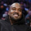 Kanye West smiles