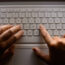 Person uses laptop