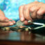 Elderly woman counting her money, UK