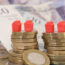 Models of homes on coins