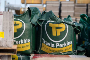 Travis Perkins reveals it axed 400 jobs and closed branches to slash costs