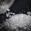 Sea salt is poured from a salt shaker