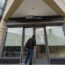 A person reads a notice posted on the front doors of a Silicon Valley Bank branch that reads 'FDIC Acts to Protect All Depositors of the former Silicon Valley Bank, “Santa Clara, California,' in Pasad