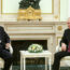 Russian President Vladimir Putin, right, and Chinese President Xi Jinping talk to each other during their meeting at the Kremlin in Moscow, Russia, Monday, March 20, 2023. (Russian Presidential Press Office via AP)