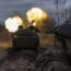 A Ukrainian artillery vehicle fires on the front line