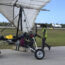 Key West International Airport personnel examine an ultralight aircraft that landed illegally at the airport carrying two Cuban men
