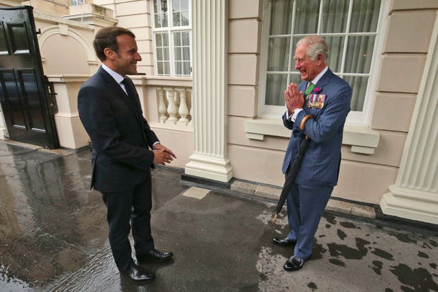 beb8d37873a4402bb714837da24c2aa3 The then-prince of Wales welcomes French president Emmanuel Macron, left, to Clarence House in London in June 2020