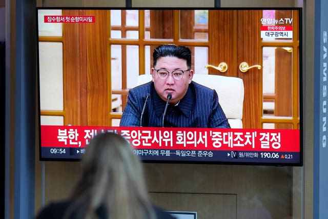A TV screen shows an image of North Korean leader Kim Jong Un during a news programme