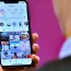 Man looks at mobile phone