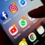 A smartphone with Facebook and YouTube apps