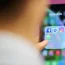 Facebook, Messenger, Instagram and WhatsApp social media app icons on a smartphone