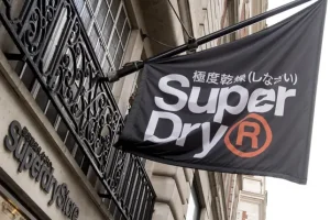 Superdry cuts profit outlook as wholesale slumps