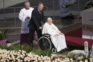 Pope celebrates Easter with big crowd in flower-adorned Vatican square