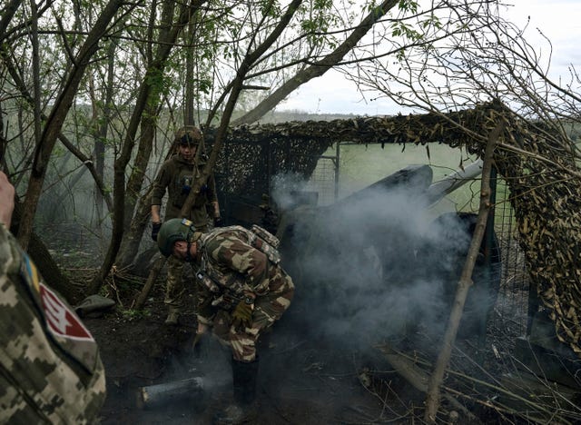 0637826e17794d4d8cf8a643a00e3deb-1 Ukrainian soldiers fire a cannon near Bakhmut, an eastern city where fierce battles against Russian forces have been taking place, in the Donetsk region, Ukraine