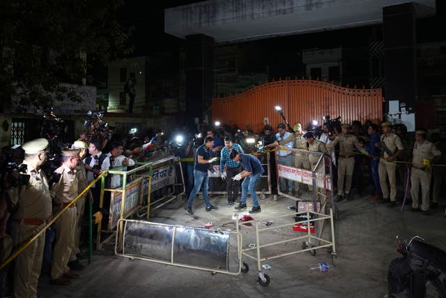 0706c8adda254b45bed8ce18817f1616 Forensic people inspect the site where Atiq Ahmad and his brother Ashraf were shot in front of the Motilal Nehru medical college in Prayagraj, India