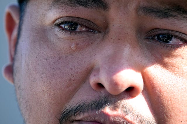 0ed0a66219ae4afb9c35ef7f9a05060c Wilson Garcia sheds a tear as he talks about his wife and son