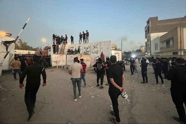 Protesters angered by the planned burning of a copy of the Koran stormed the embassy