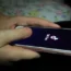 A young girl uses the TikTok app on a smartphone