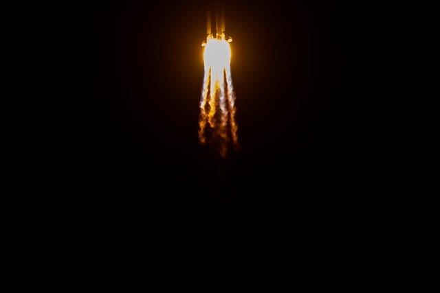 A Long March-5 rocket carrying the Chang’e 5 lunar mission during lift-off (Mark Scheifelbein/AP)