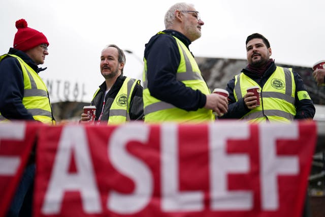 2-70454500 Members of the Aslef union picket at New Street station in Birmingham