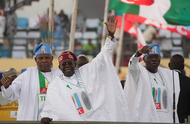 287adf850a6c4fa6bd8b9b9b5eceeacd Bola Tinubu, centre, greets supporters during an election campaign rally in Lagos, Nigeria