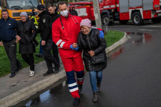 340dbc2e8f5a4675b1f98429d63f7ef0 A woman cries next to the residential building hit in Uman