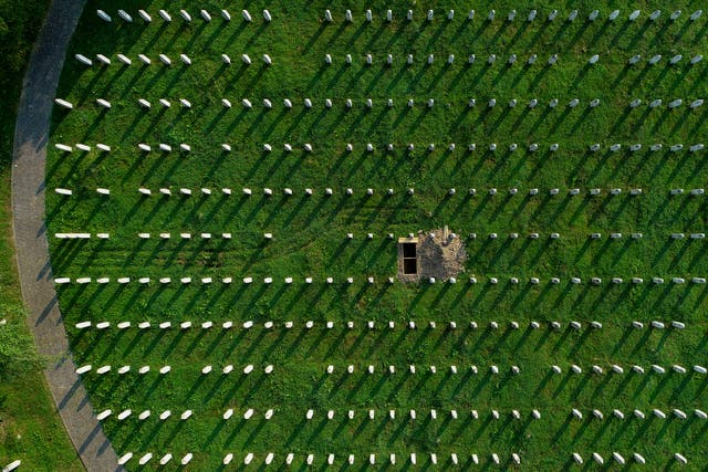 New grave in massacre cemetery