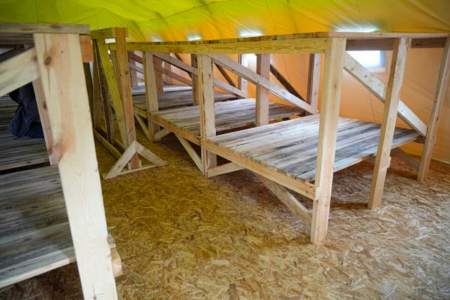 4096c26c1fc247d8ada16728d3f1a07a An indoor view of a tent in the Belarusian army camp