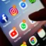Social media apps, including Facebook, Instagram, YouTube and WhatsApp, displayed on a mobile phone screen