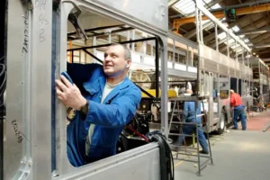 Manufacturing sector shrinks for fourth consecutive month as job cuts rise