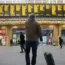 Passengers view departure boards at King's Cross station in London during a strike by members of the Rail, Maritime and Transport union