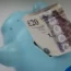 A piggy bank and banknotes