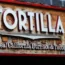 A Tortilla restaurant sign