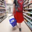 Shopper walking through the aisle of a supermarket