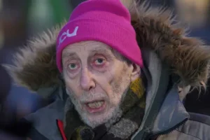 Poet Michael Rosen marches with nurses out of ‘gratitude’ after his Covid coma