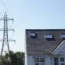 Pylon next to a house