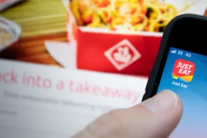 Just Eat increases annual earnings outlook, but orders continue to fall