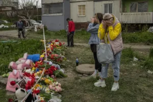 Relatives bury children killed in Russian missile attack